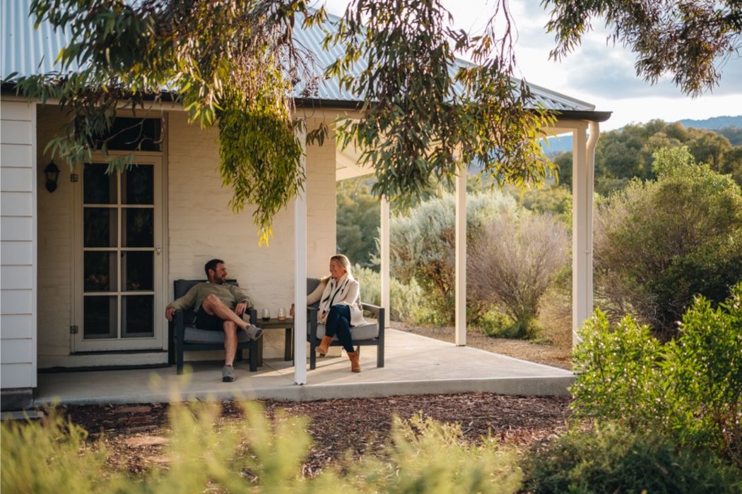 Arkaba homestead outside couple enjoying wine relaxing